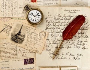 old letter and post cards with feather quill